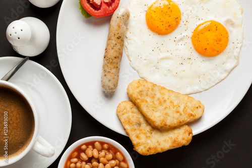 American breakfast set : baked bean, fried egg (Sunny side up), hotdog, hash browns