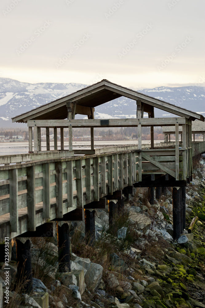 View of Comox harbour, mountains and Comox glacier from the dock at Fisherman's Wharf
