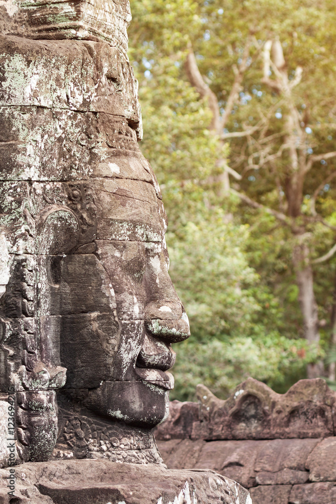 Massive stone carving faces of Bayon temple in Angkor Thom, Siemreap, Cambodia Massive stone carving faces of Bayon temple in Angkor Thom, Siemreap, Cambodia