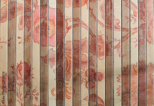 red flower on bamboo mat, background
