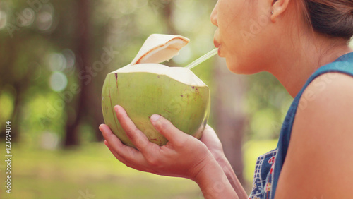 Cute Girl drinking coconut water