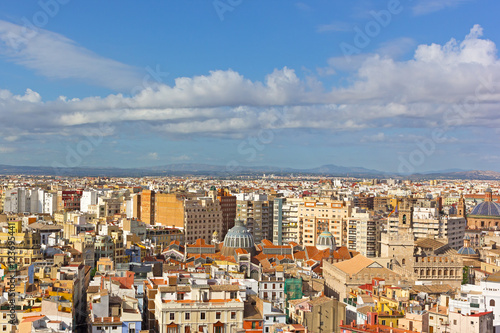 Aerial view of Valencia old city architecture around Central Market (Mercado Central). City skyline with mountains on horizon in Valencia, Spain