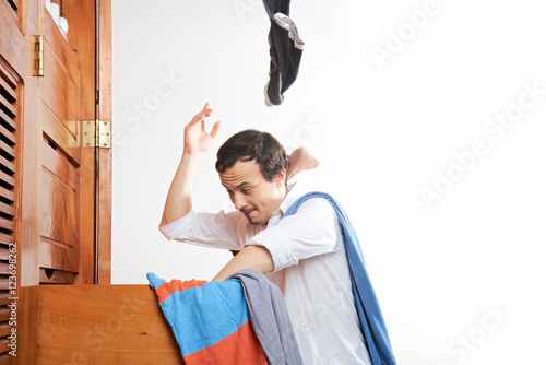Obraz na płótnie man throwing clothes in air