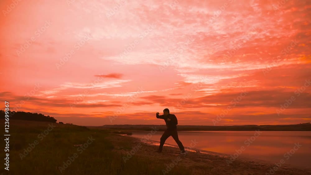 man engaged in melee combat sports boxing at sport sunset shadow boxing man engaged in melee combat sports boxing at sport sunset shadow boxing
