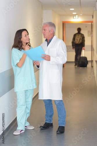 Hospital staff talking in corridor