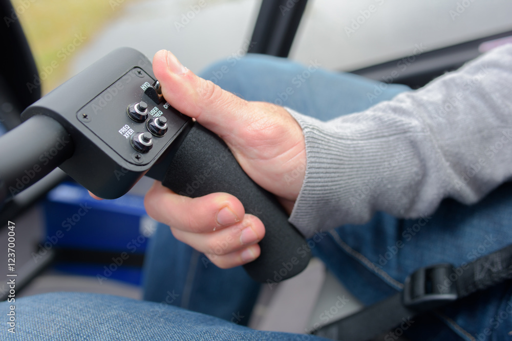 Hand on steering controls Hand on steering controls