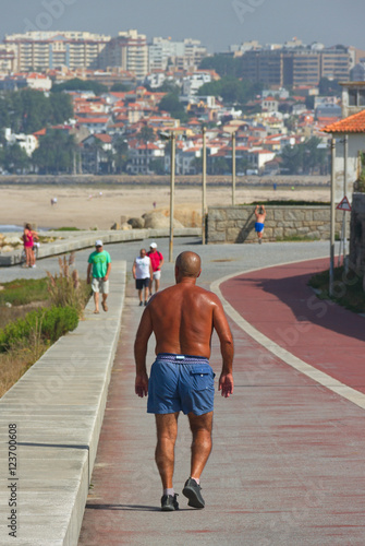 People actively relax by the ocean.