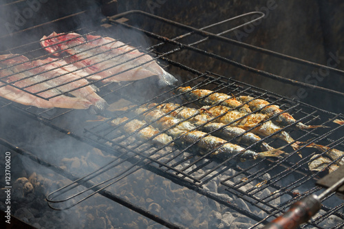 Fried fish on a hot coal. photo