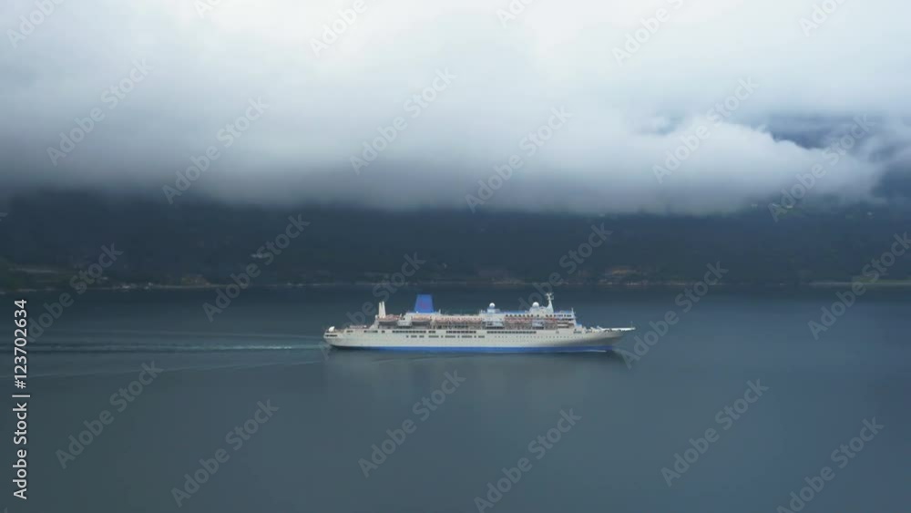 Aerial Shot of River Cruise Ship. Weather is Cloudy and Foggy. Aerial Shot of River Cruise Ship. Weather is Cloudy and Foggy.