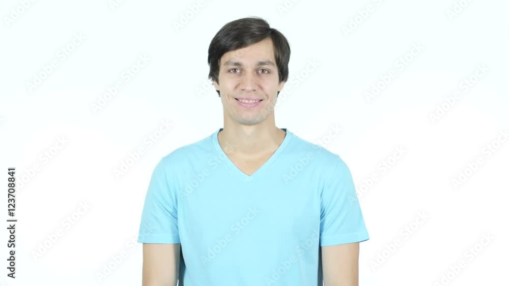 Portrait Of Smiling Young Casual Man, White Background Portrait Of Smiling Young Casual Man, White Background