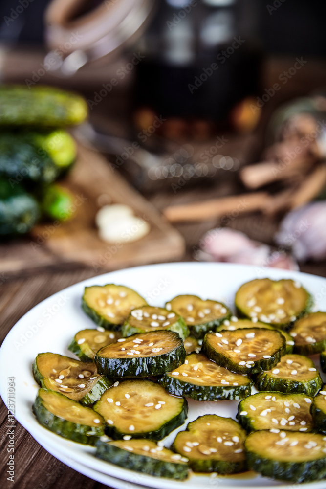 Slices of pickled cucumbers with sesame seeds