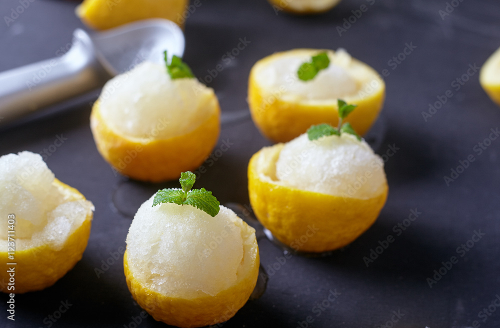 Lemon sorbet or ice cream inside fresh lemons