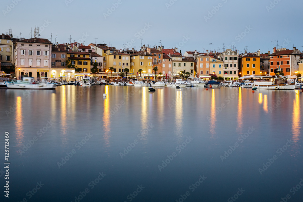 Embankment historic part of Rovinj, Croatia. The lights reflected in the water