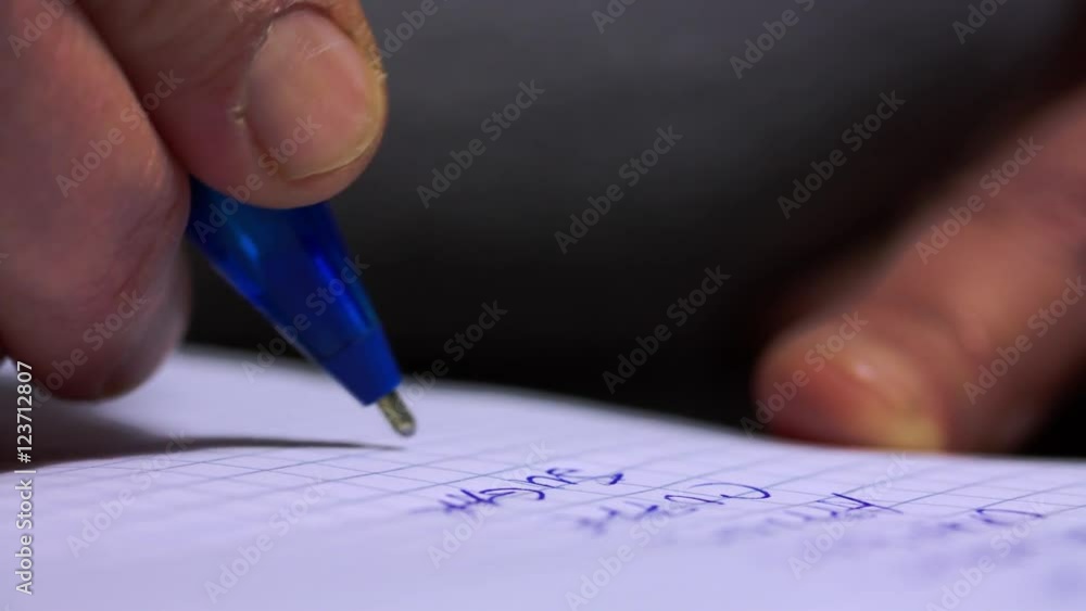 Macro Shot Of A Woman Hand Writing A shopping List Macro Shot Of A Woman Hand Writing A shopping List