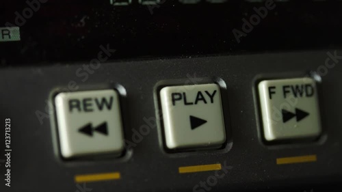 Finger Pushing The Play Button Of A BetaMax Player photo