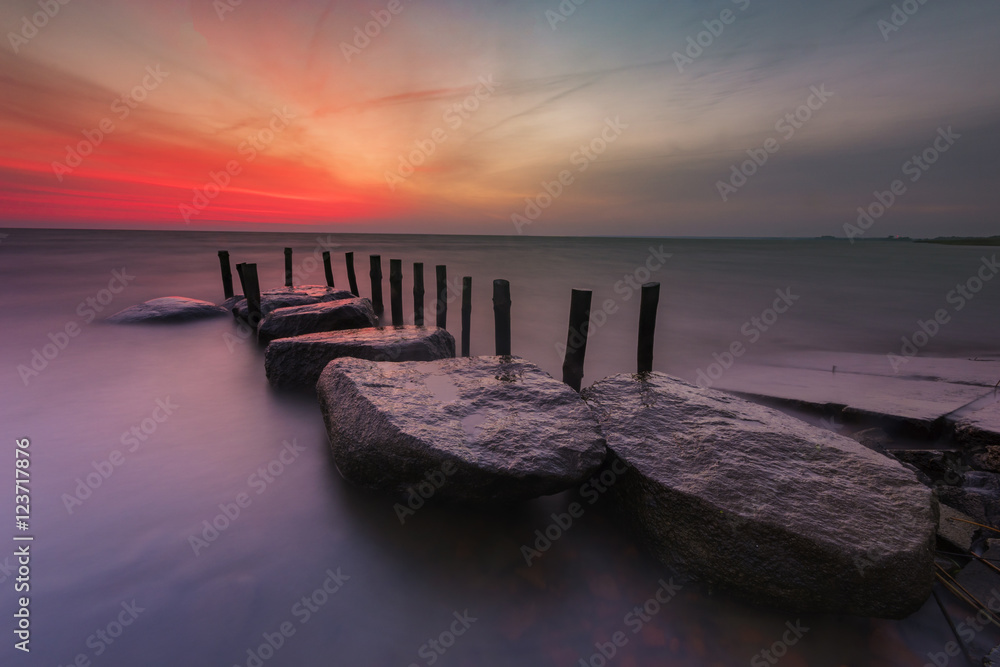 sunrise over the sea, stone harbor, long exposure
