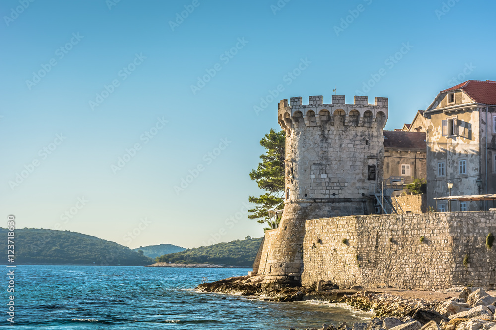 Korcula old town tower. / Scenic view at old town Korcula tower and walls, Adriatic sea, Croatia.