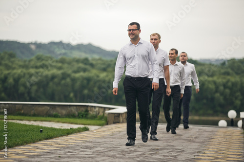 The groomsmen go on the wedding ceremony © nastasenko