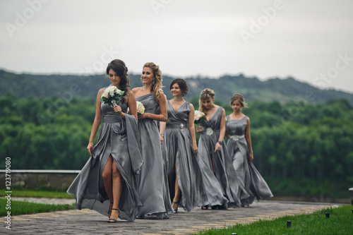 The bridesmaids  go on the wedding ceremony