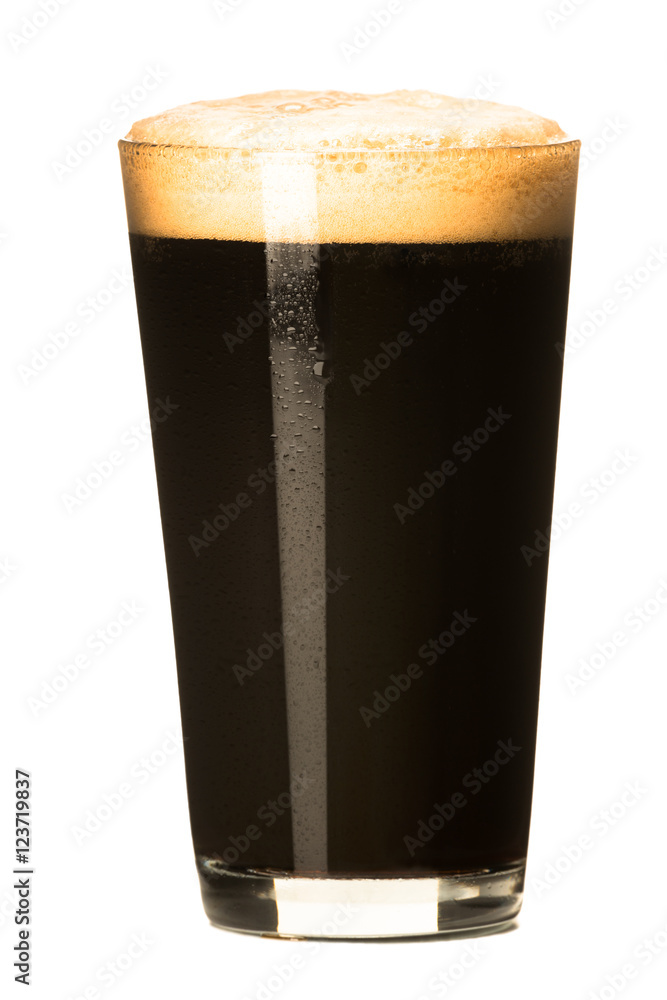 PInt of dark stout beer with thick foam head isolated on white background - obrazy, fototapety, plakaty 