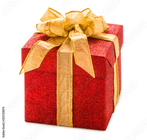 Glittering red Christmas gift box present with gold ribbon bow isolated on white background