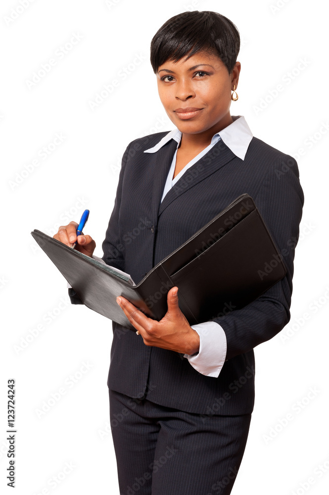 Serious African American female businesswoman accountant ceo with notebook isolated on white background Serious African American female businesswoman accountant ceo with notebook isolated on white background