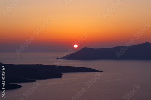 view on sunset in Fira town on Santorini photo