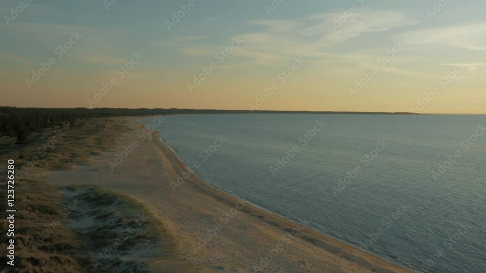 Aerial Shot of Coastal Forest, Beach and Sea in Sunset Light. Aerial Shot of Coastal Forest, Beach and Sea in Sunset Light.