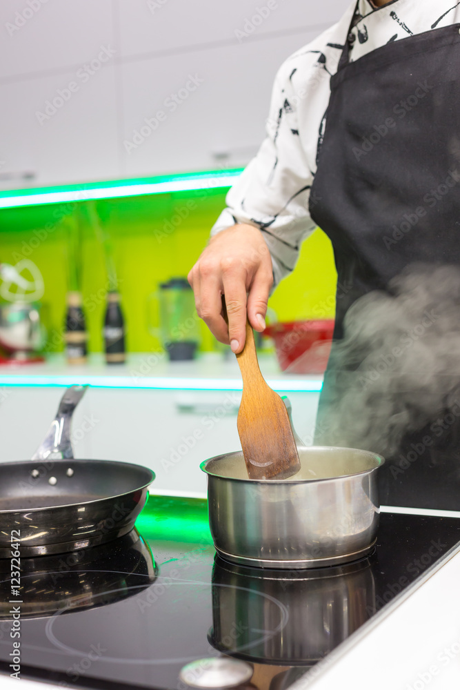 Man cooking sauce Man cooking sauce
