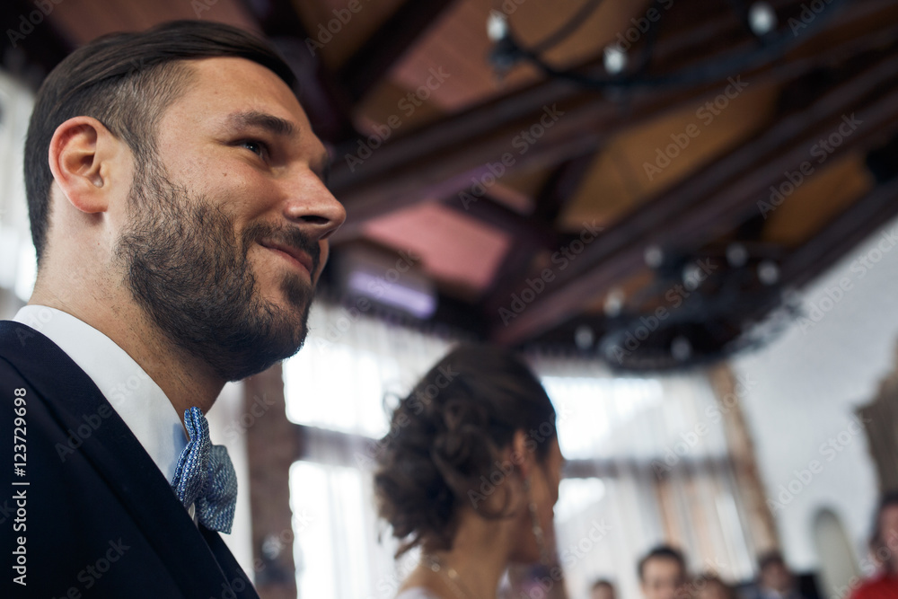 A look from below on smiled bearded groom A look from below on smiled bearded groom