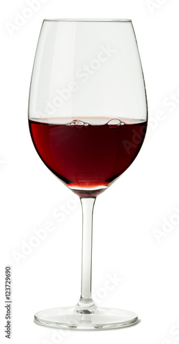 Glass of red wine cabernet suavignon merlot zinfandel malbec grenache syrah shiraz with rich dark red light coming through isolated on white background photo