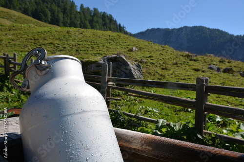 Hut in german alps with milk can photo