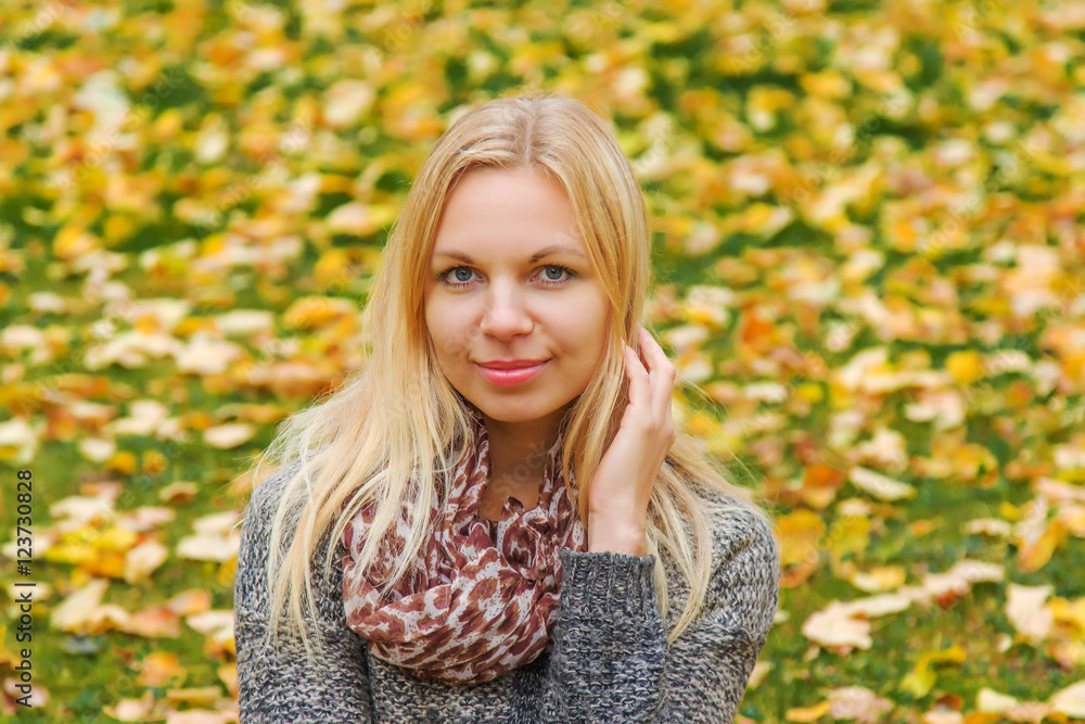Young, beautiful, gentle woman in the park in autumn when leaves become colorful. Young, beautiful, gentle woman in the park in autumn when leaves become colorful.