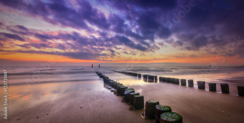 Beautiful sunset at the beach during golden hour with nice reflections