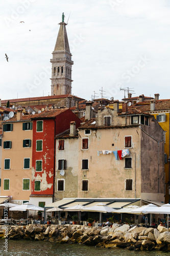 The historic part of Rovinj in Croatia with the Church of Saint Euphemia and the sea. photo