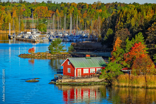 Red house on rocky shore of Ruissalo island, Finland photo