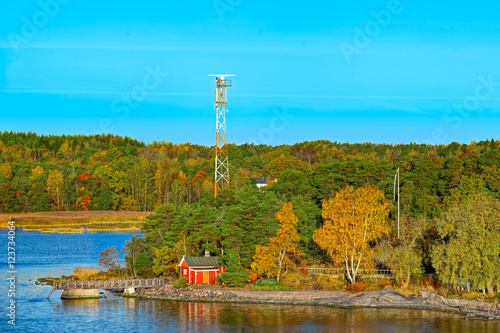 Red house on rocky shore of Ruissalo island, Finland photo