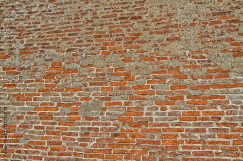 old wall of red brick and gray