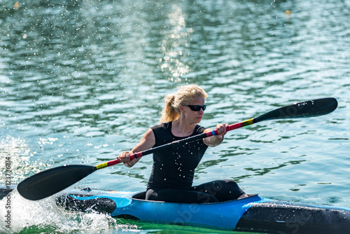 Kayak. Young woman kayaking © Microgen