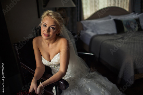 Glance of the bride in the beautiful wedding dress © nastasenko