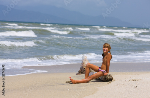 Happy little girl on beach
