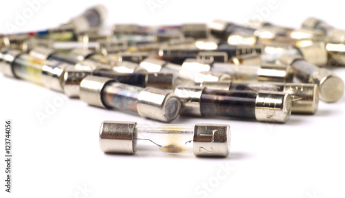 Fotografie a bunch of blown fuses on white background, macro, shallow depth of field