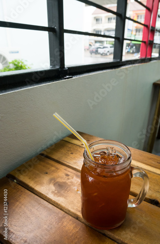 Glass of ice lemon tea in estaurant photo