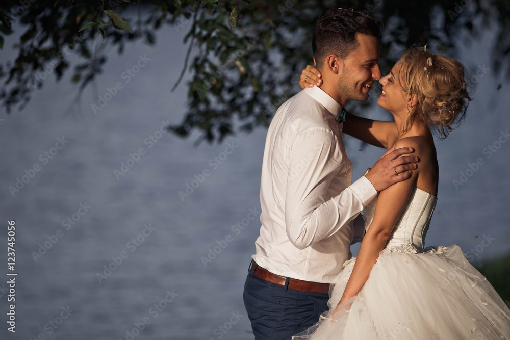 groom spend time with his woman at the lake