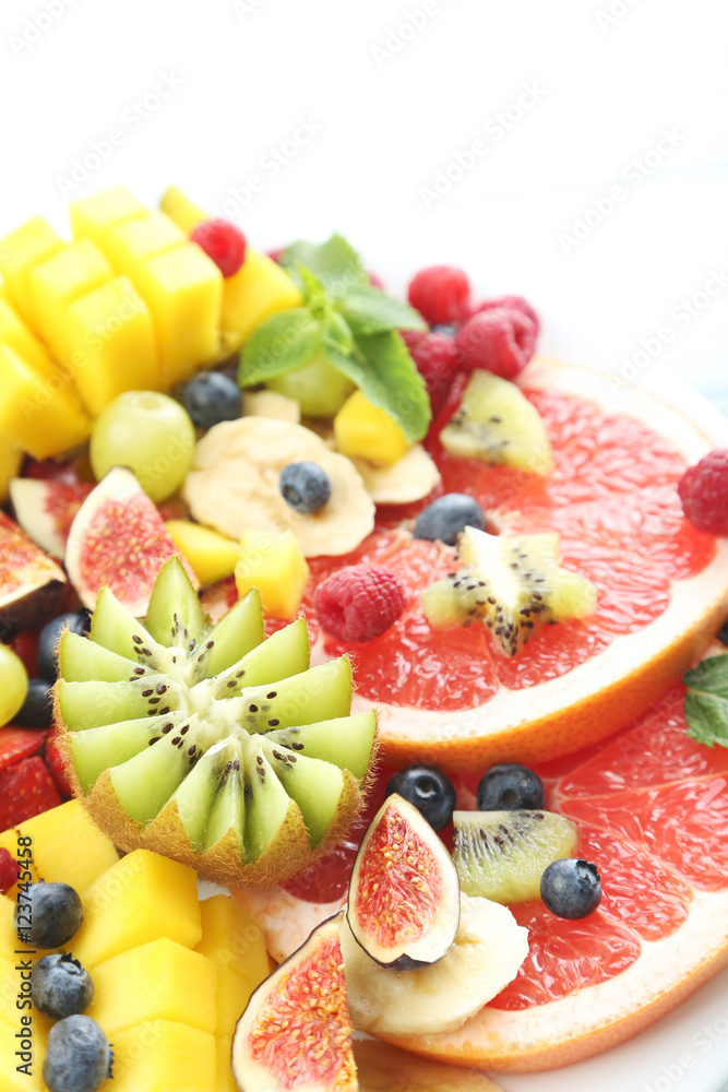 Fresh fruit salad on a white wooden table Fresh fruit salad on a white wooden table