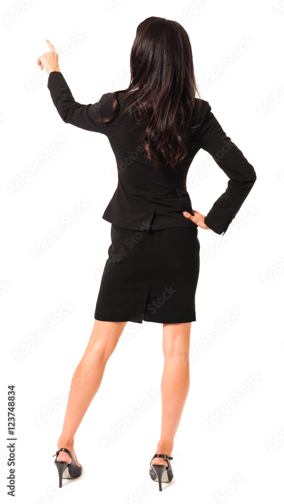Full-length rear view businesswoman pointing isolated on white background Full-length rear view businesswoman pointing isolated on white background
