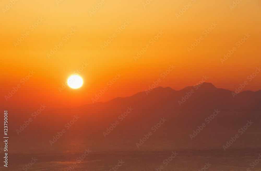 Fototapeta premium sunrise on Santorini behind Anafi island