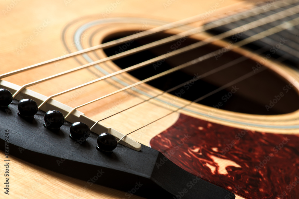 Obraz premium acoustic guitar detail of the bridge and of the saddle
