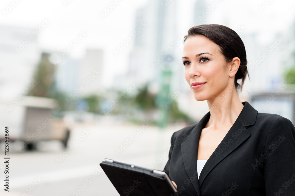 Fototapeta premium Businesswoman with Digital Tablet Computer Outdoors Downtown