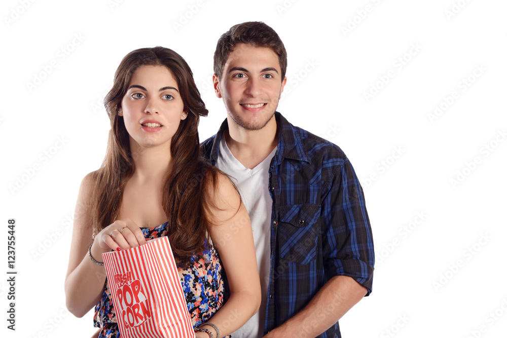 Naklejka premium Young couple watching a movie and eating popcorn.